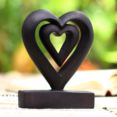 Wood statuette, 'Two Loves in Black' - Hand Carved Black Suar Wood Heart Statuette