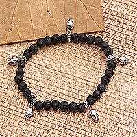 Lava stone beaded stretch bracelet, 'Lava Skulls' - Lava Stone and Sterling Silver Beaded Skull Bracelet