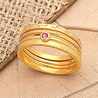 Gold-plated cubic zirconia stacking rings, 'Pink Slip in Gold' (set of 4) - Gold-Plated Cubic Zirconia Stacking Rings (Set of 4)