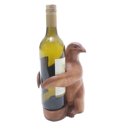 Wood wine bottle holder, 'Bird Hug' - Artisan Made Suar Wood Bird Wine Holder