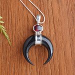 Garnet pendant necklace, 'Mysterious Crescent' - Sterling Silver and Garnet Pendant Necklace