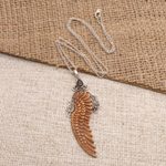 Garnet pendant necklace, 'Angelic Song' - Bone and Garnet Angel Wing Pendant Necklace