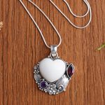 Garnet and amethyst pendant necklace, 'Garden of Love' - Amethyst and Garnet Heart-Themed Pendant Necklace