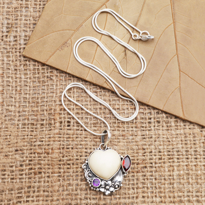 Garnet and amethyst pendant necklace, 'Garden of Love' - Amethyst and Garnet Heart-Themed Pendant Necklace