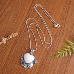 Garnet and amethyst pendant necklace, 'Garden of Love' - Amethyst and Garnet Heart-Themed Pendant Necklace