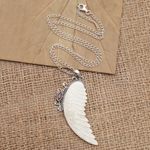 Garnet pendant necklace, 'Pale Angel' - Garnet and Sterling Silver Angel Wing Pendant Necklace