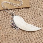 Garnet pendant necklace, 'Pale Angel' - Garnet and Sterling Silver Angel Wing Pendant Necklace