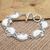 Blue topaz link bracelet, 'Moon Over Ocean' - Sterling Silver and Blue Topaz Crescent Moon Link Bracelet
