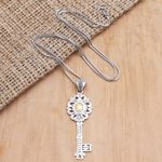Gold-accented pendant necklace, 'Unlock' - Gold-Accented Sterling Silver Key-Motif Pendant Necklace