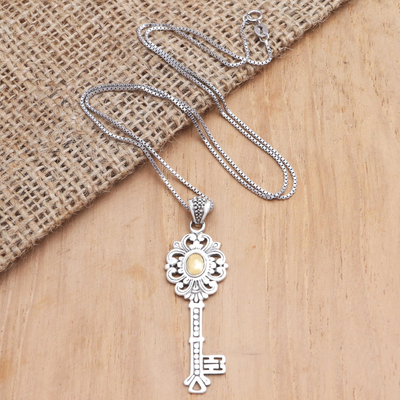 Gold-accented pendant necklace, 'Unlock' - Gold-Accented Sterling Silver Key-Motif Pendant Necklace