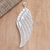 Sterling silver filigree pendant, 'Under Wing' - Handmade Sterling Silver Filigree Pendant from Java