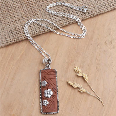 Sterling silver pendant necklace, 'Scent of Snow' - Sawo Wood Pendant Necklace with Floral Motif
