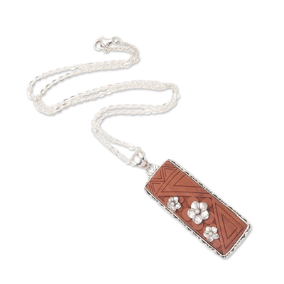 Sterling silver pendant necklace, 'Scent of Snow' - Sawo Wood Pendant Necklace with Floral Motif