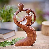 Wood statuette, 'Father's Protection' - Artisan Crafted Suar Wood Statuette