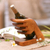 Wood wine holder, 'Lend a Hand' - Hand Crafted Suar Wood Bottle Holder thumbail