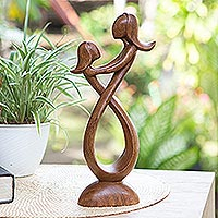 Wood statuette, 'Infinite Feeling' - Artisan Crafted Suar Wood Statuette from Bali
