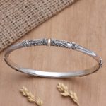 Gold-accented bangle bracelet, 'Mountain Pass' - Gold-Accented Sterling Silver Bangle Bracelet