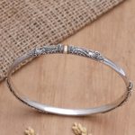 Gold-accented bangle bracelet, 'Mountain Pass' - Gold-Accented Sterling Silver Bangle Bracelet
