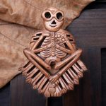 Wood puzzle box, 'Bare Bones' - Handmade Suar Wood Puzzle Box with Skeleton Motif