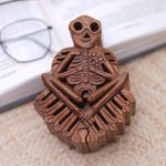 Wood puzzle box, 'Bare Bones' - Handmade Suar Wood Puzzle Box with Skeleton Motif