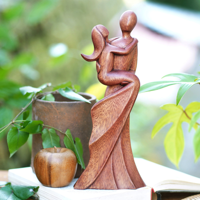 Wood statuette, 'Swept Up' - Artisan Crafted Suar Wood Statuette from Bali