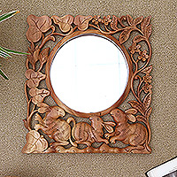 Wood wall mirror, 'Rabbit Garden' - Hand-Carved Wood Floral Rabbit Wall Mirror from Bali