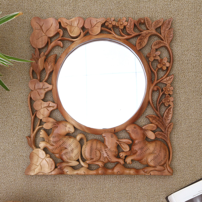 Wood wall mirror, 'Rabbit Garden' - Hand-Carved Wood Floral Rabbit Wall Mirror from Bali