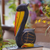 Wood statuette, 'Pelican Crossing in Black' - Hand-Painted Albesia Wood Pelican Statuette