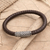 Leather and sterling silver pendant bracelet, 'Good News' - Woven Leather and Sterling Silver Pendant Bracelet