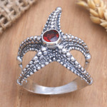 Garnet cocktail ring, 'Red Starfish' - Garnet Sterling Silver Starfish Cocktail Ring from Bali