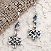 Blue topaz dangle earrings, 'Bloom Dignity in Blue' - Floral Motif Blue Topaz 925 Silver Dangle Earrings from Bali
