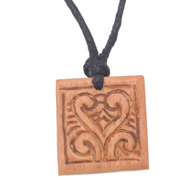 Men's wood pendant necklace, 'Courage Spirals' - Men's Sawo Wood Pendant Necklace with Cotton Cord