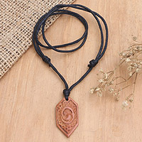 Men's wood pendant necklace, 'Strong Hero' - Men's Wood Pendant Necklace with Cotton Cord from Indonesia
