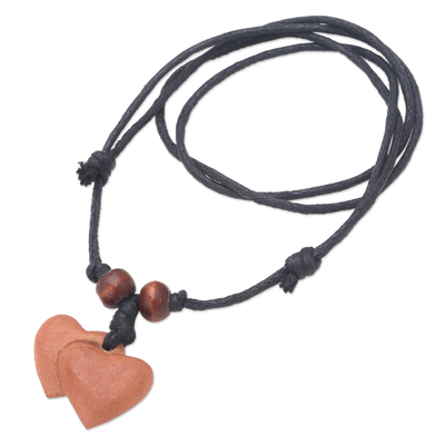 Wood pendant necklace, 'Joined Hearts' - Sawo Wood Heart Pendant Necklace with Cotton Cord