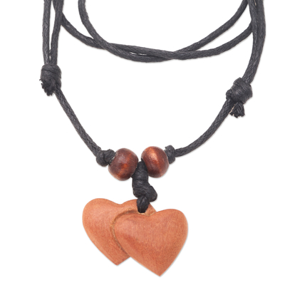 Wood pendant necklace, 'Joined Hearts' - Sawo Wood Heart Pendant Necklace with Cotton Cord