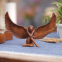 Wood statuette, 'Resting Angel' - Hand Carved Suar Wood Angel Statuette from Bali