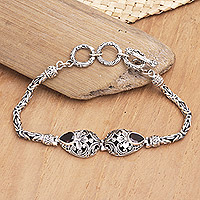 Garnet pendant bracelet, 'Garnet Garden of Bali' - Sterling Silver Garnet Pendant Bracelet with Floral Motifs