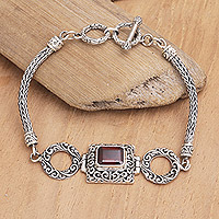 Garnet pendant bracelet, 'Two Ways Out' - Sterling Silver and Garnet Pendant Bracelet Designed in Bali