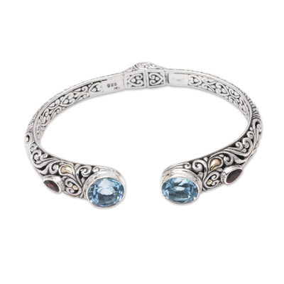 Gold-accented blue topaz and garnet cuff bracelet, 'Divine Blue' - Handmade Sterling Silver Blue Topaz Cuff Bracelet from Bali