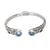 Gold-accented blue topaz and garnet cuff bracelet, 'Divine Blue' - Handmade Sterling Silver Blue Topaz Cuff Bracelet from Bali thumbail