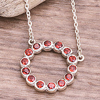 Garnet pendant necklace, 'Garnet Flourish' - Sterling Silver and Garnet Pendant Necklace from Bali