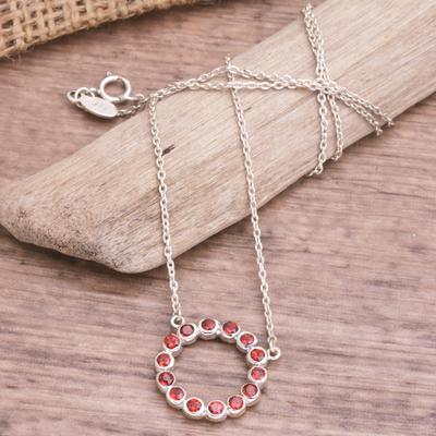 Garnet pendant necklace, 'Garnet Flourish' - Sterling Silver and Garnet Pendant Necklace from Bali