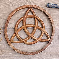 Wood relief panel, 'Everlasting Sign' - Suar Wood Relief Panel with Hand-Carved Triquetra Symbol