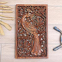 Wood relief panel, 'Blooming Peacock' - Hand-Carved Suar Wood Leafy Relief Panel with Peacock
