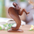 Wood sculpture, 'Warm Angel' - Suar Wood Brown Sculpture with Hand-Carved Angel