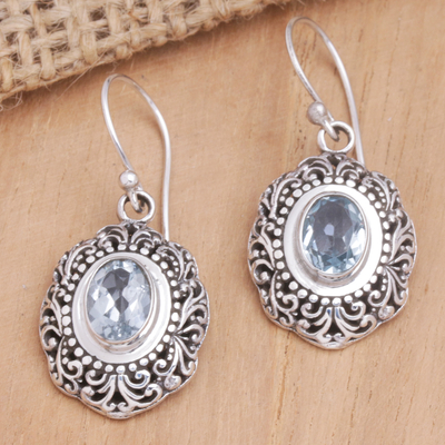 Blue topaz dangle earrings, 'Blue Medallion of Bali' - Balinese Sterling Silver Dangle Earrings with Blue Topaz