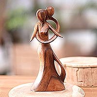 Wood sculpture, 'Graceful Hug' - Hand-Carved Suar Wood Sculpture with Loving Couple