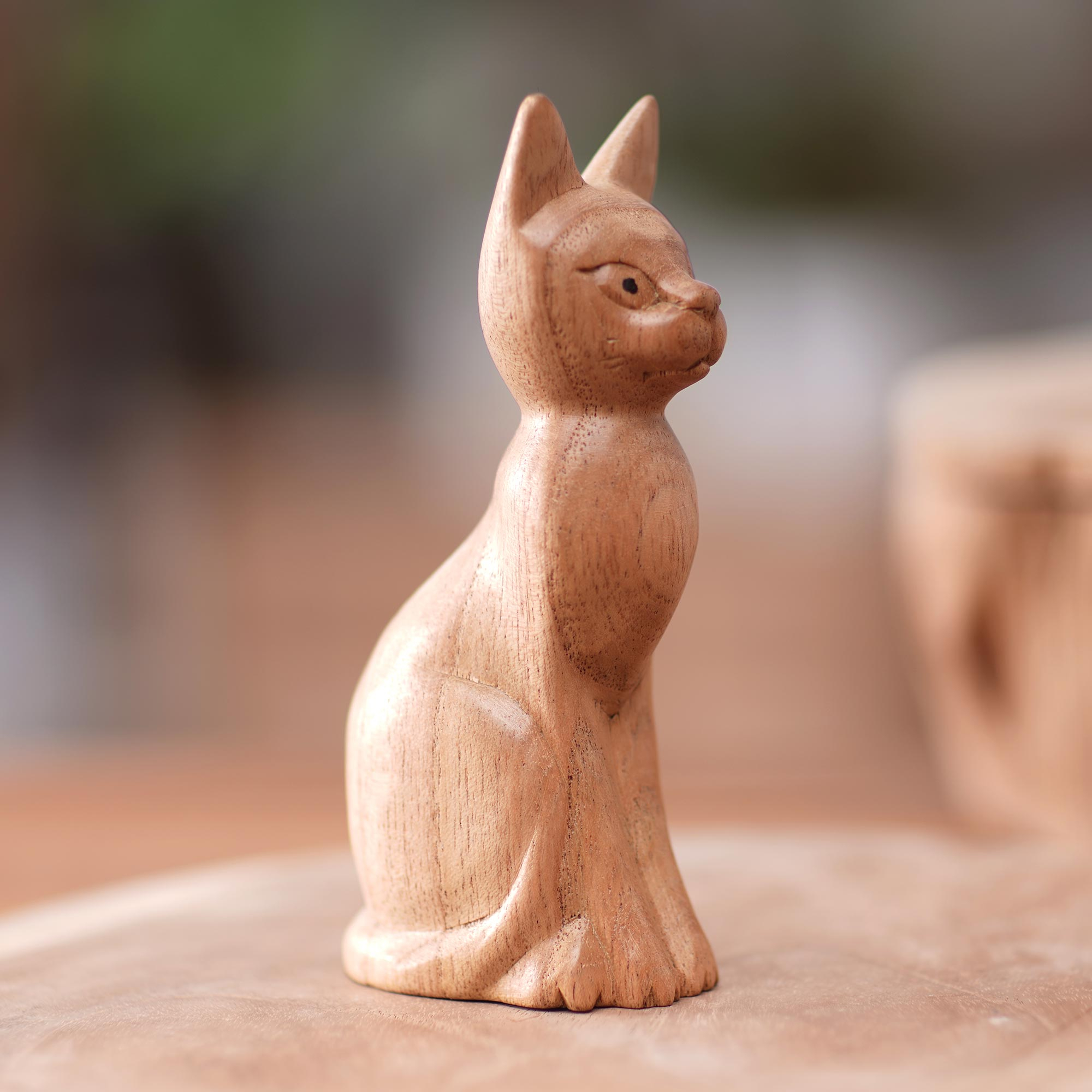 Brown Cat Sculpture Hand-Carved from Jempinis Wood in Bali - Cunning Cat