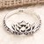 Sterling silver band ring, 'Floral Rebirth' - Sterling Silver Band Ring with Lotus Flower Motif (image 2) thumbail
