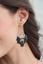 Horn and garnet dangle earrings, 'Midnight Bat' - Horn Garnet & Sterling Silver Bat Dangle Earrings from Bali